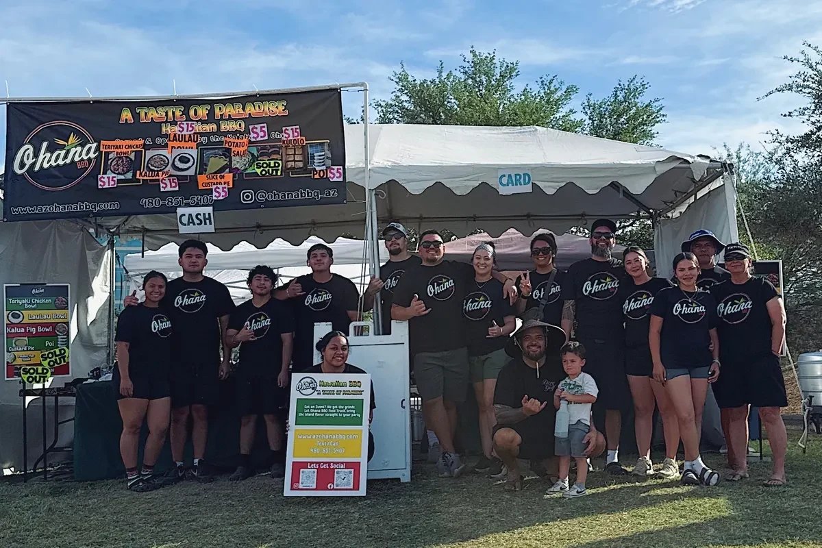 The Ohana BBQ crew together under their tent at an event
