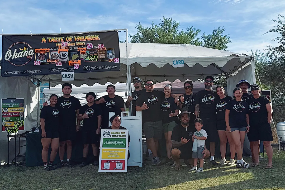 The Ohana BBQ crew together under their tent at an event